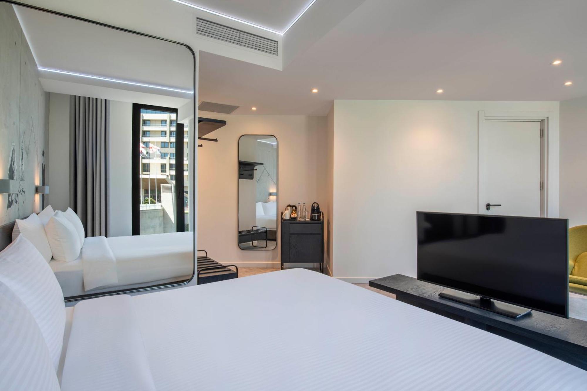 Готель Golden Tulip Design Тбілісі Номер фото